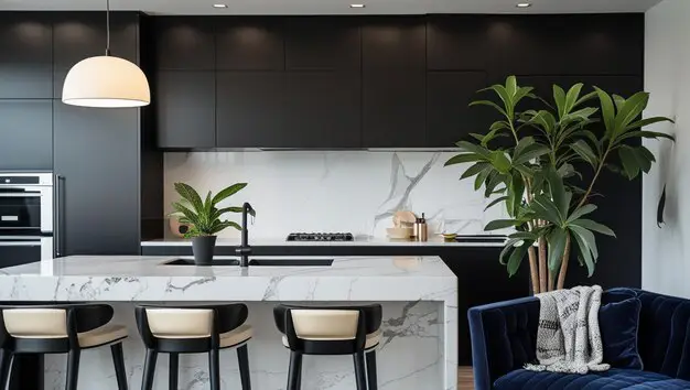 Luxury kitchen featuring white marble benchtops and gold tapware accents in a Melbourne home