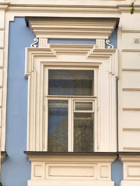 Decorative colonial style architrave around a timber door