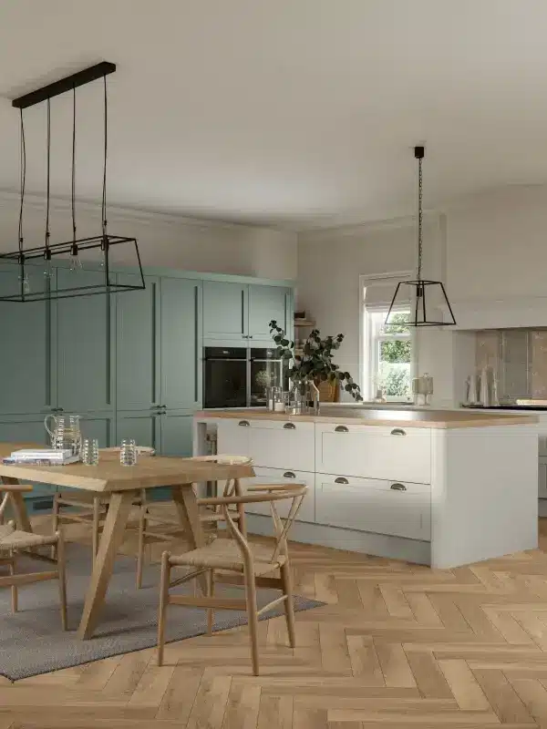 Traditional kitchen design featuring white Shaker cabinets and timber benchtops